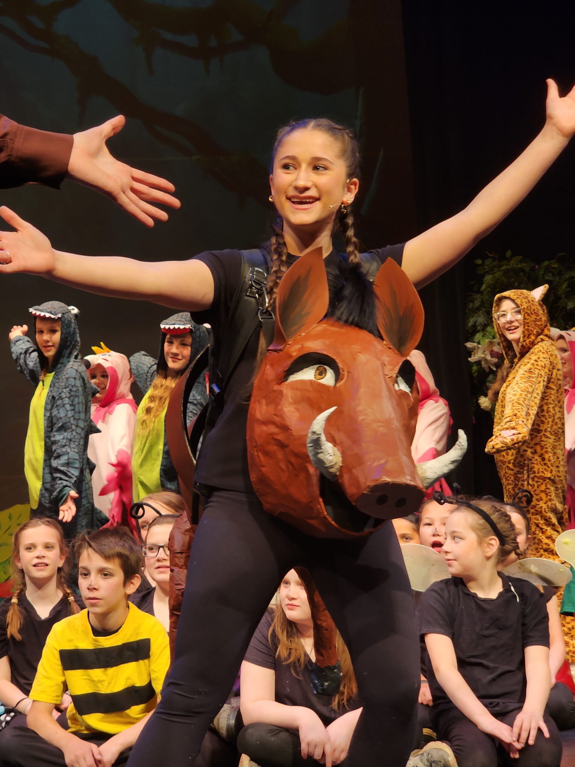 Grace students performing together in a school stage production