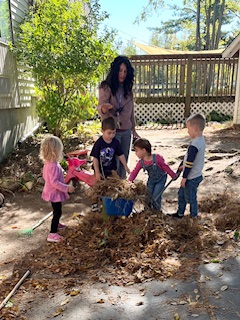 Young children exploring and playing outdoors at Grace