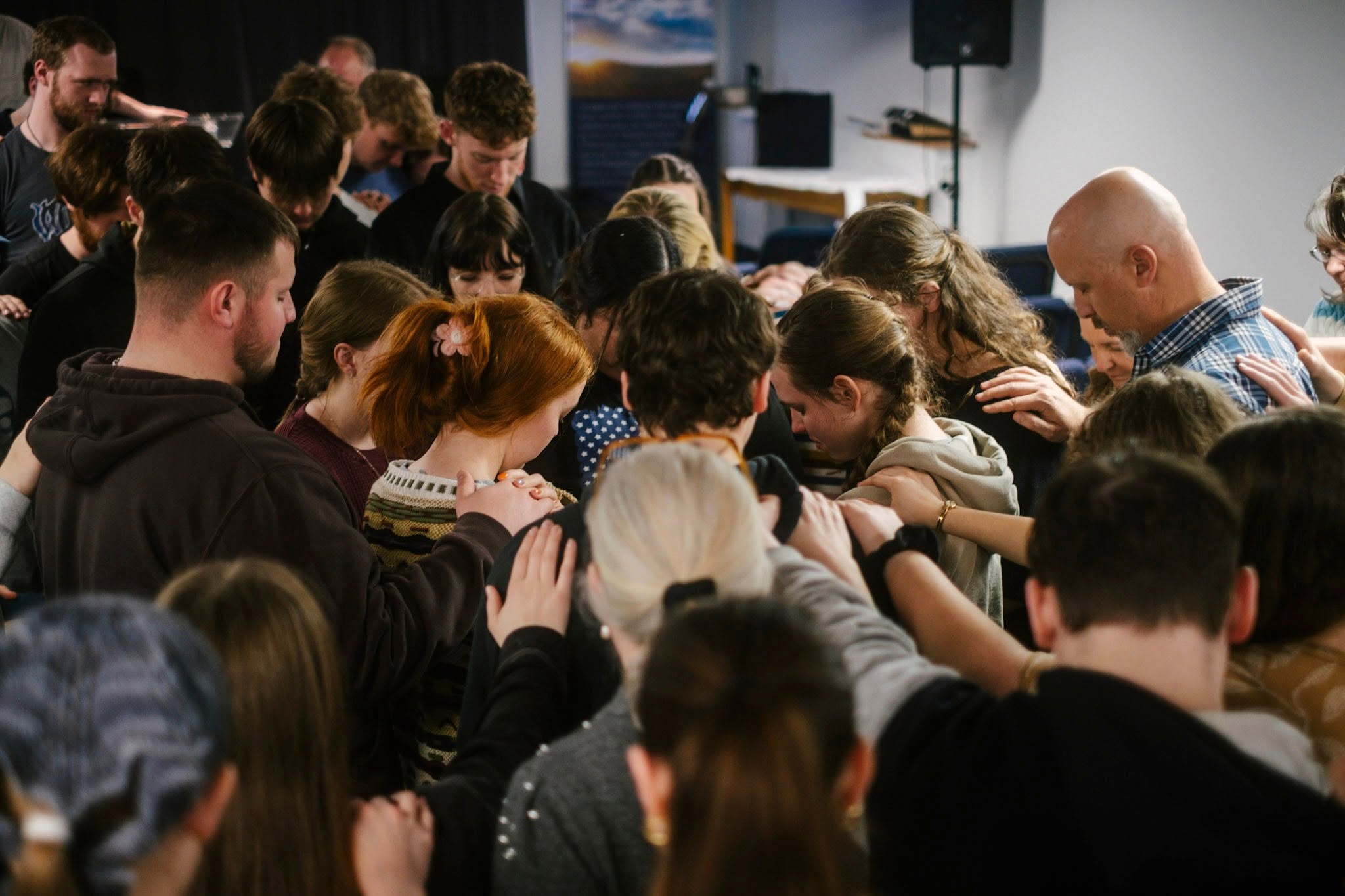 Students participating in a prayer gathering