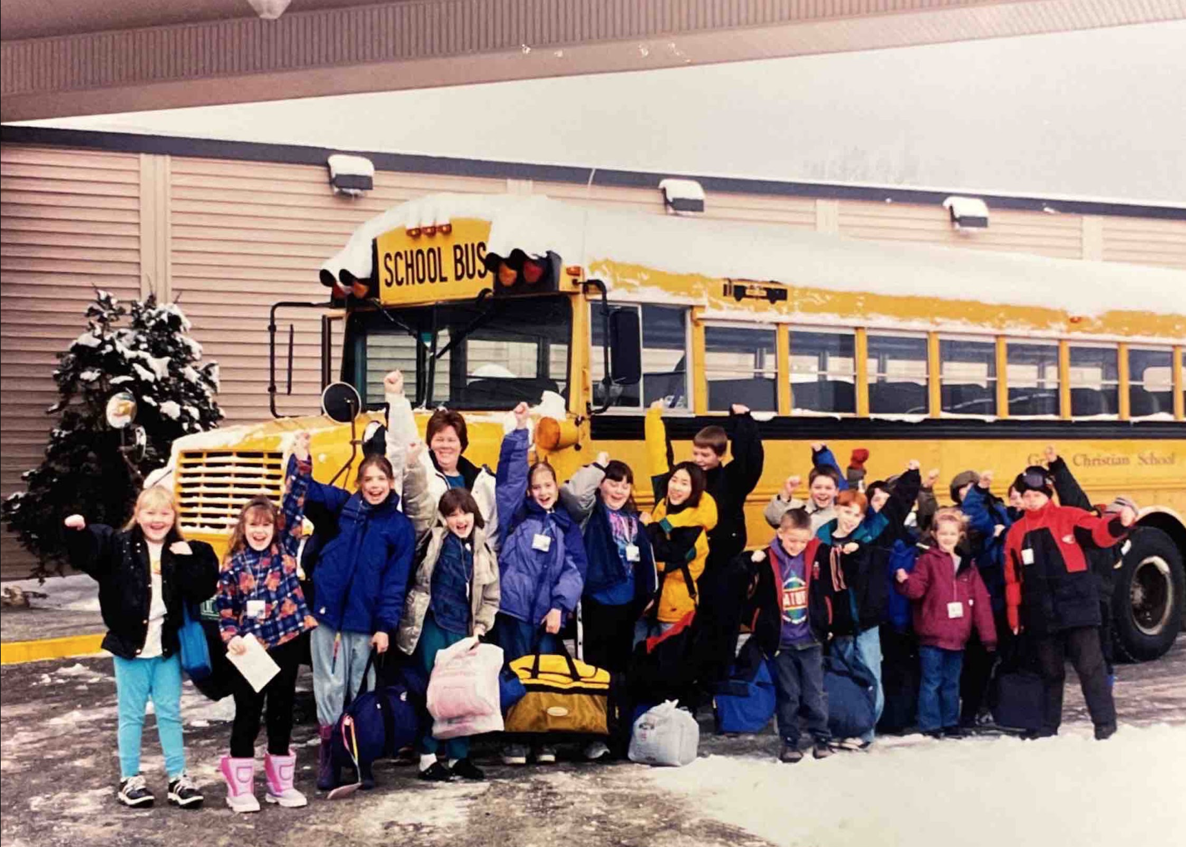 Joyce Lloyd, Grace Christian School's first principal, pictured with students