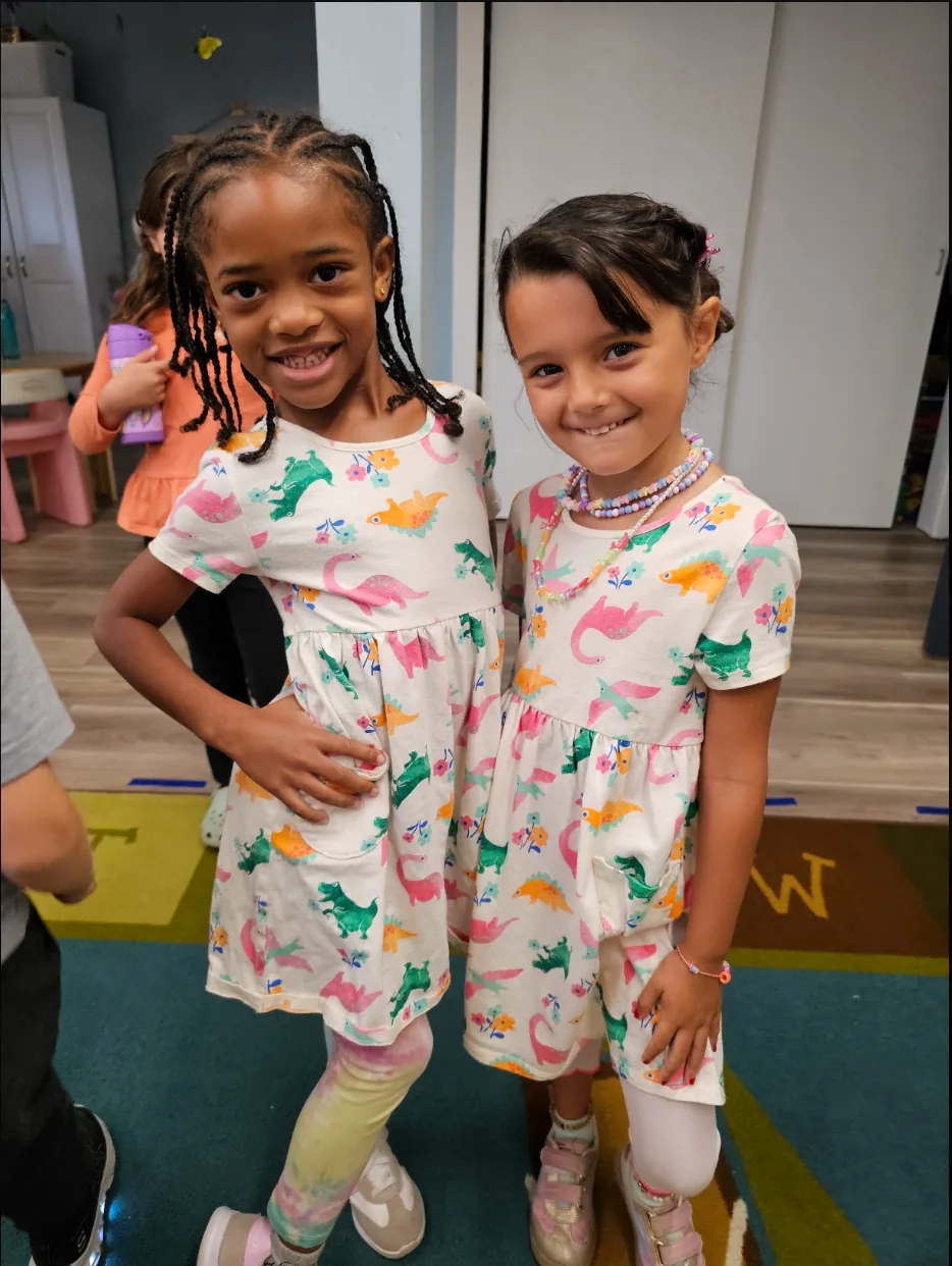 Two smiling Grace students enjoying friendship at school