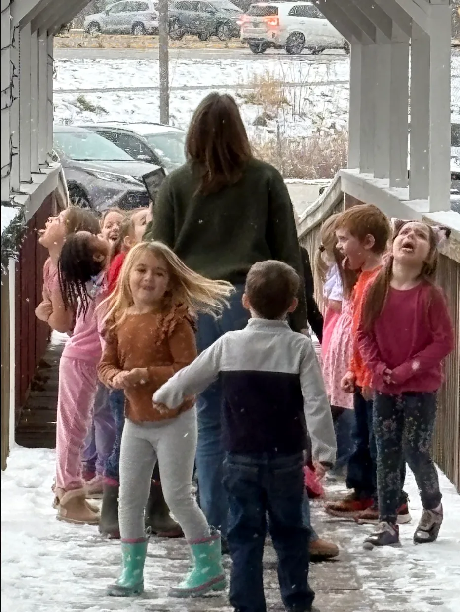 Grace Christian School elementary students enjoying a snowy day together with their teacher
