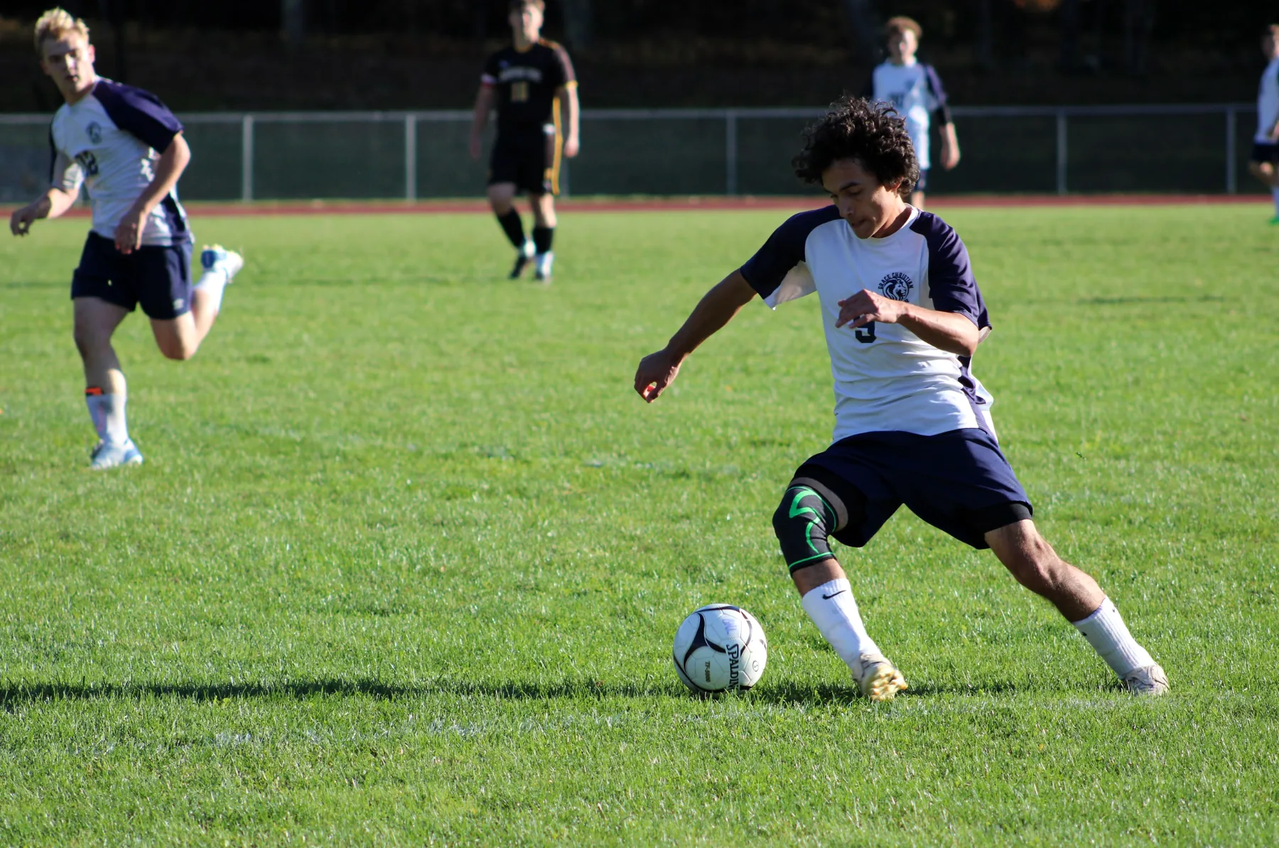 Grace Christian School Lions soccer player competing on the field